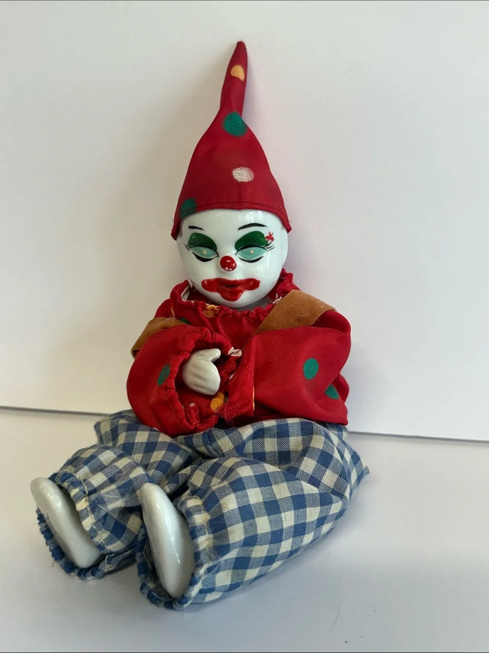 Vintage Porcelain Clown Doll in Red Hat and Checked Pants
